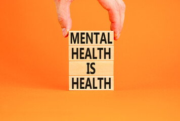 Mental health psychological symbol. Concept words Mental health is health on wooden blocks on a...