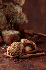 Oatmeal raisin cookies on a brown table.