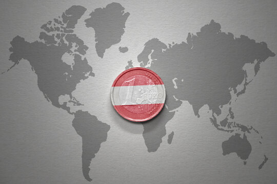 euro coin with national flag of austria on the gray world map background.3d illustration. - Powered by Adobe