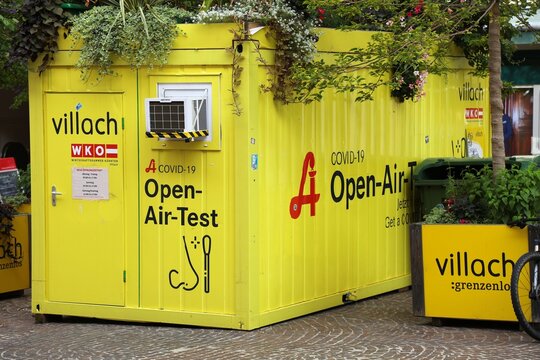 VILLACH, AUSTRIA - AUGUST 7, 2022: Covid-19 outdoor testing facility in a shipping container at the main square of Villach, Austria.