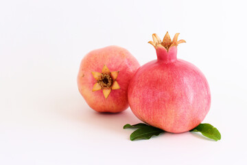 Rosh hashanah (jewish New Year holiday) concept. Pomegranate traditional symbol over white background