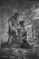 Pompeii ruins, Italy. Roman fresco from the House of Menander. Portrait of Menander (famous Greek dramatist). Inspiration, creativity culture and heritage concepts. Black white historic photo.