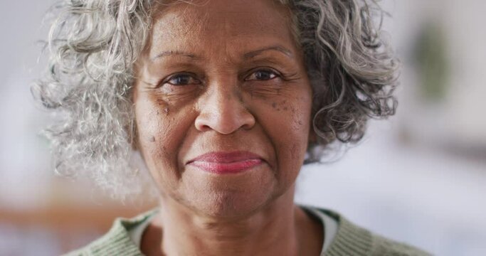 Portrait of happy senior african american woman looking at camera and smiling