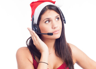 Christmas headset woman from telemarketing call center wearing red santa hat talking smiling isolated on white background.