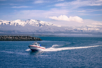 Fishing boat enters the harbor of Akureyri in the north of Iceland