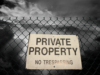 Private property sign on a fence
