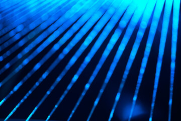 Abstract blue line of bokeh water flowing pattern with black background.