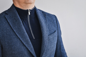 Classic tweed men's jacket with blue sweater with zip. Fashion and lifestyle. Portrait of a...