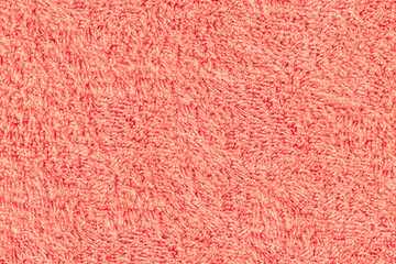 Textile texture. Background from a terry towel. Pink colour.