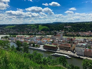 Fototapeta premium The historical city of Passau seen from Veste Oberhaus on a beautiful day in spring