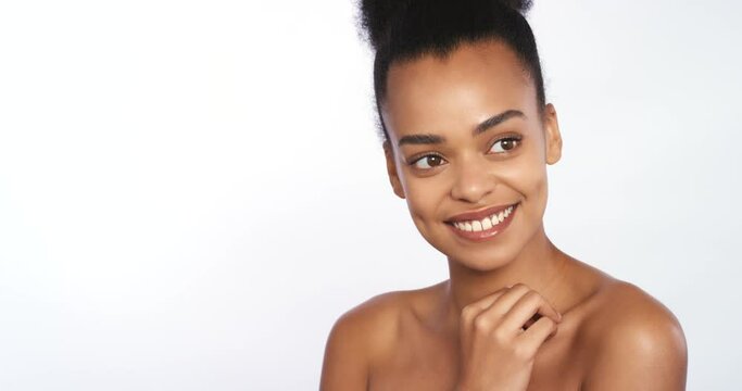 Beauty, skincare and body with a beautiful woman touching her skin in studio on a white background with mockup. Bodycare, cosmetics and wellness with a happy young female rubbing her shoulder