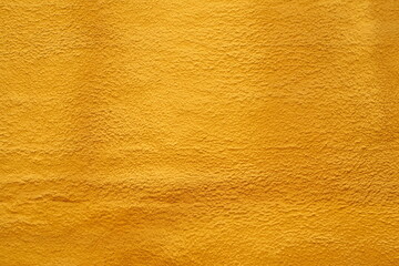 Orange background texture. Plaster painted in orange color background texture