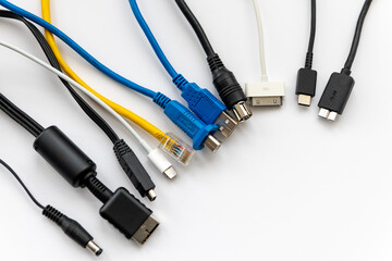 Various types of cable connectors for electronic devices isolated in white.