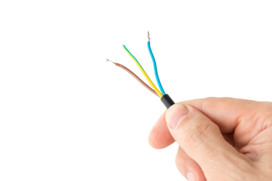 three-core wire in a hand close-up, on a white isolated background