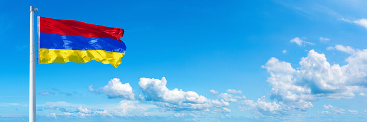 Armenia flag on a blue sky *** Horizontal banner 12000 x 4000 px