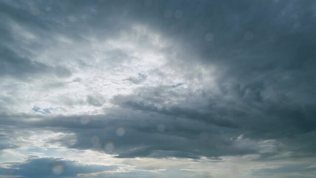 Sky before storm. Stormy cloudy sky wide panorama. Storm cloudy dramatic sky with dark rain grey cumulus cloud and blue sky. Timelapse.