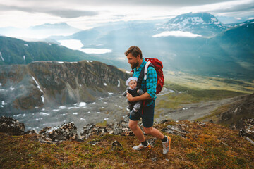 Naklejka na ściany i meble Active family vacations father trail running with baby outdoor travel adventure vacation healthy lifestyle dad with kid in mountains of Norway