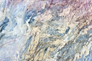 Natural stone marble rock surface by the stream.  Stone marble texture background.Selective focus.