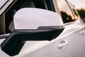 close-up car side mirror with LED turn signal, modern car, modern car safety systems