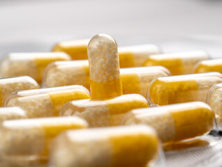 Vitamin C capsules on a white background.