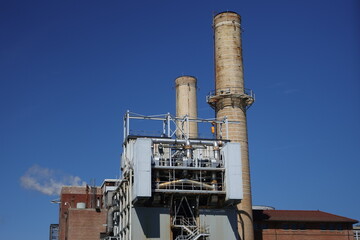 Stacks and piping of a fossil fuel-burning power plant in Washington D.C.