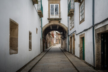 Fototapeta na wymiar Arch House (Casa do Arco) at Medieval Santa Maria Street - Guimaraes, Portugal