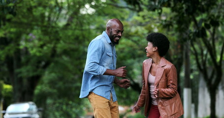Fototapeta premium African couple dancing outside in street