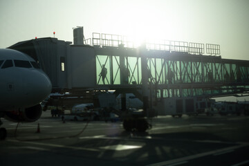 airport glass passage leading to airplane