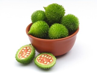 Green spiny gourd in a bowl on white background 