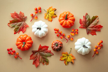 Obraz na płótnie Canvas Fall autumn flat lay background. Pumpkins and fall leaves. Autumn decorations.