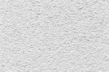 Sample of a texture of white plaster. Wall finished with a decorative cement stucco. Example of exterior building decoration. Clean uniform grainy background. Banner. Wallpaper. Copy space. Pattern