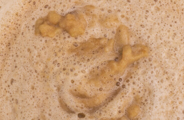 An the process of cooking apple jam. The jam boils and the foam appears. Recipe concept
