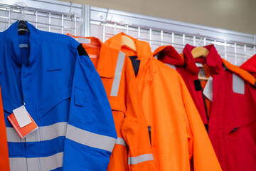 Jackets with reflective stripes - road workers special clothing. Workwear, protection clothing and outfit concept