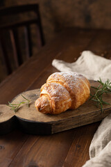 Homemade croissant on wood table and coffee time break concept