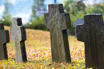 old grave crosses in autumn