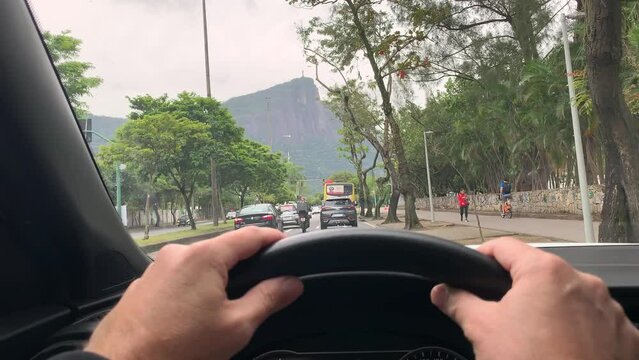 Rio de janeiro Brazil. Driver's point of view on an avenue, with Christ the Redeemer in the background.