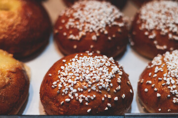 Variety assortment of traditional finnish sweets and pastries with cinnamon bun, and cardamon roll and rolls, butter bun and others, korvapuusti, laskiaspulla and voisilmapulla