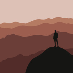 Silhouette of a man standing on the mountain