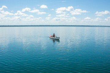 Fototapeta na wymiar Canoeing on beautiful Lake Peten Itza, El Remate, Petén, Guatemala