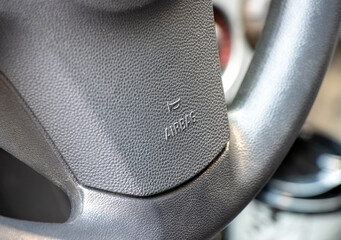 Airbag sign and text on the car steering wheel
