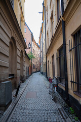 street with old houses in the center of the old city in the street of Stockholm Sweden
