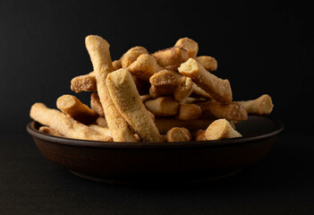 Cookies on a plate on a dark background.