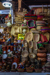 Sale of wicker baskets and various decorative items in the market of San Pedro, Cusco, Peru. 
