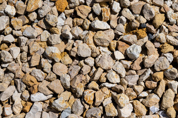 Gray gravel texture background beside the house.