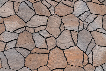 Road tiles laid out in the form of dry cracked earth