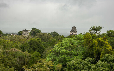 Temples I, II, and III rise above the jungle at Tikal National Park, Petén, Guatemala