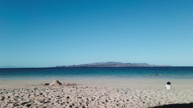 Tecolote beach people ralaxing, view Espiritu santo Island, baja california sur 15 january 2022