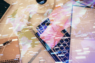 Double exposure of data hologram sketch over study table background with computer. Concept of Ai. Top view.