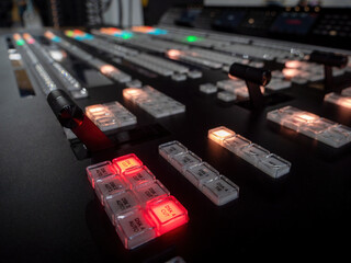 Concept Idea: Professional broadcast video mixer in tv studio as background