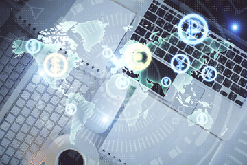 Financial market graph and top view computer on the desktop background. Multi exposure. Investment concept.